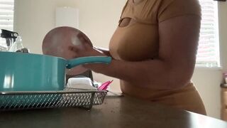 Maid washing dishes for her masturbating boss