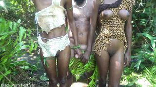 2 African tribe girl having fun with the village chief in the middle of the forrest