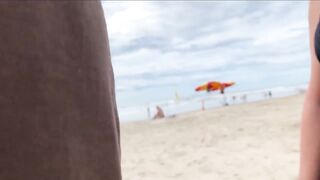 A milf jerk off a stranger on a public beach for a bet!